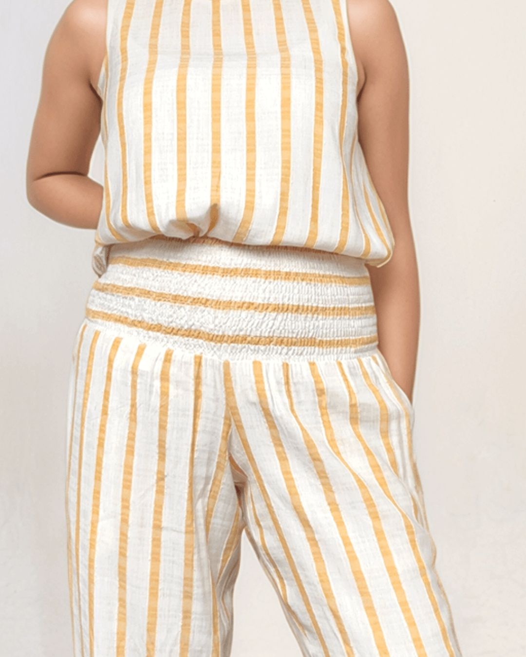 Wide leg linen trousers, in striped natural fabric, with a comfortable waistband for new mother postpartum that is suitable for after c-section and while body still has weight from a stylish UK & Ireland brand for maternity and breastfeeding, high end designer clothing and style