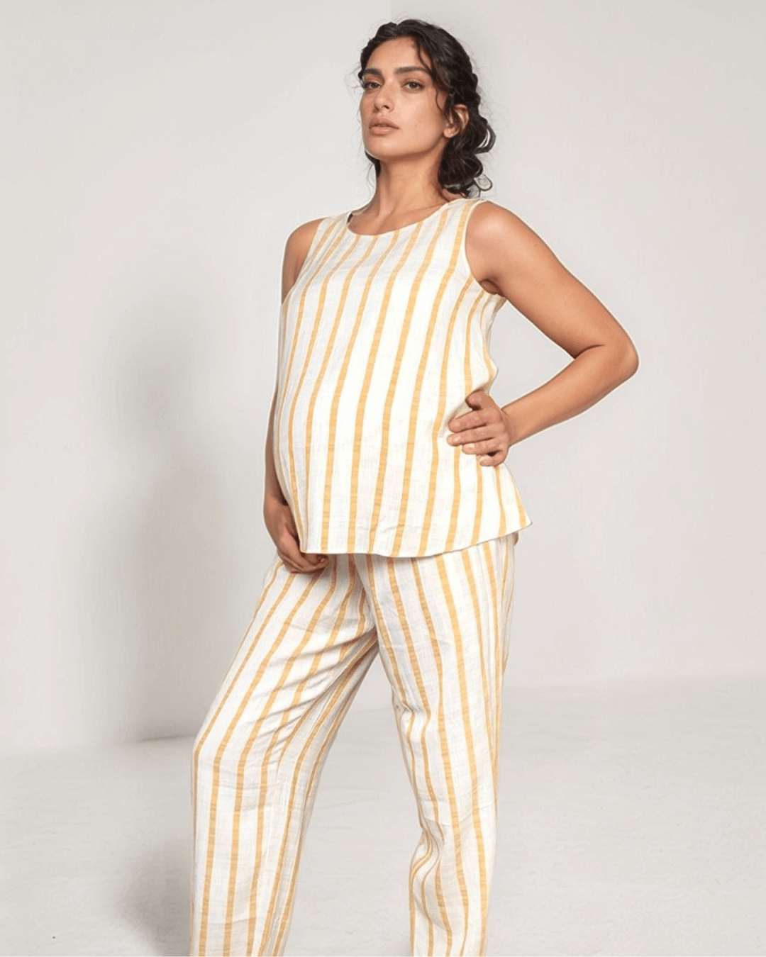 Stylish contemporary design maternity trousers for summer workwear or smart casual with shirred elastic adjustable waist, smart enough for the office or everyday, made in natural linen fabric to keep cool in summer heat, recommended maternity brand for UK, Ireland & Europe