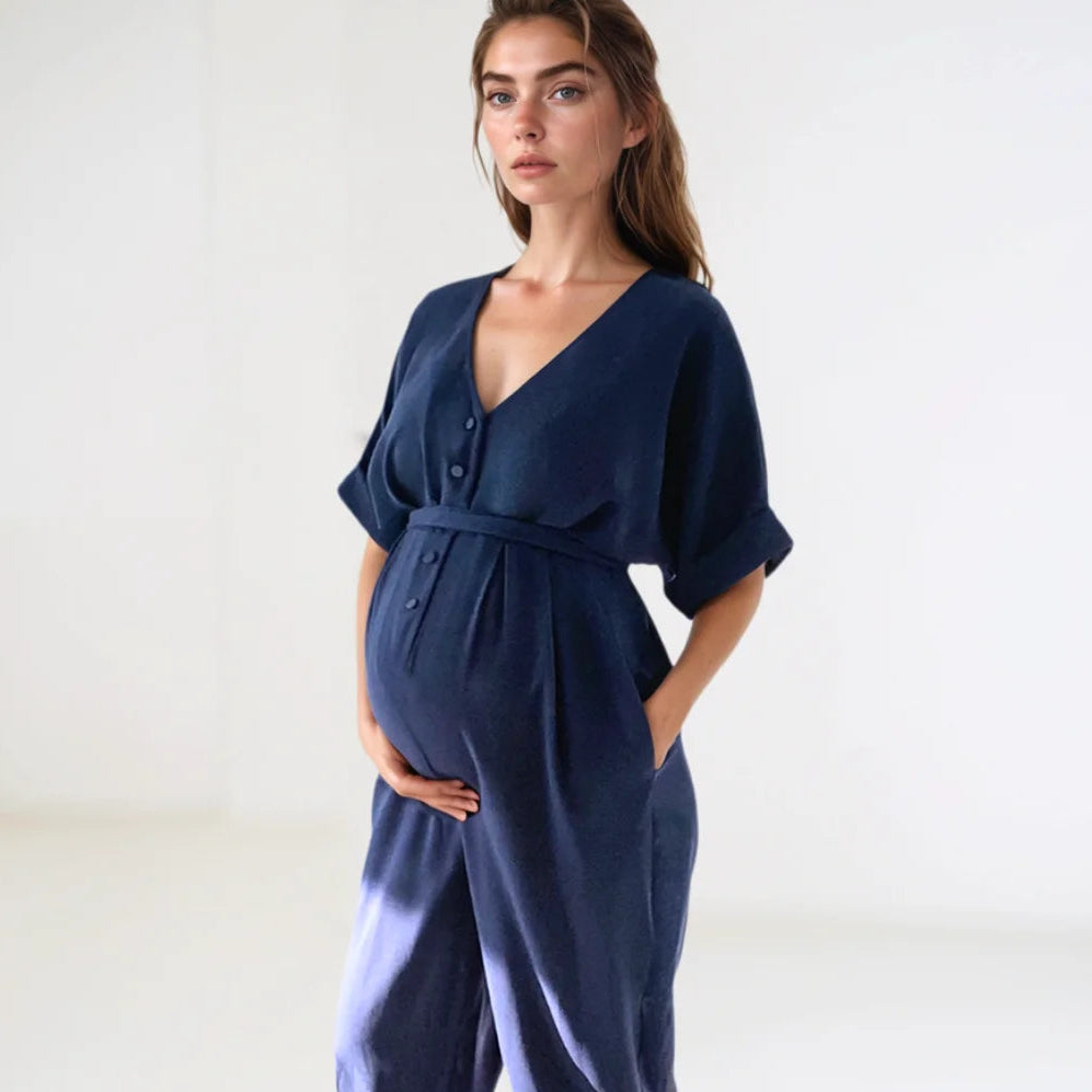 Pregnant finance professional wearing s high end navy maternity jumpsuit smart enough for office dress style - premium designer brand for business suitable clothes for pregnancy UK Ireland