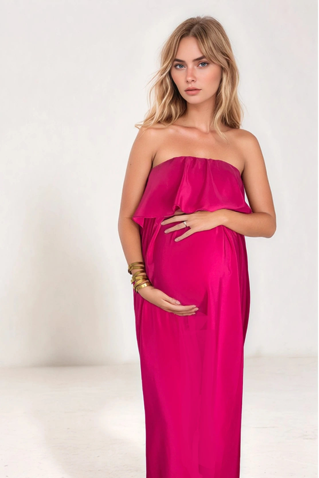 Stylish pregnant woman in a hot pink fancy evening gown - a perfect elevated style for wedding guest outfit, dressy evening events or black tie events