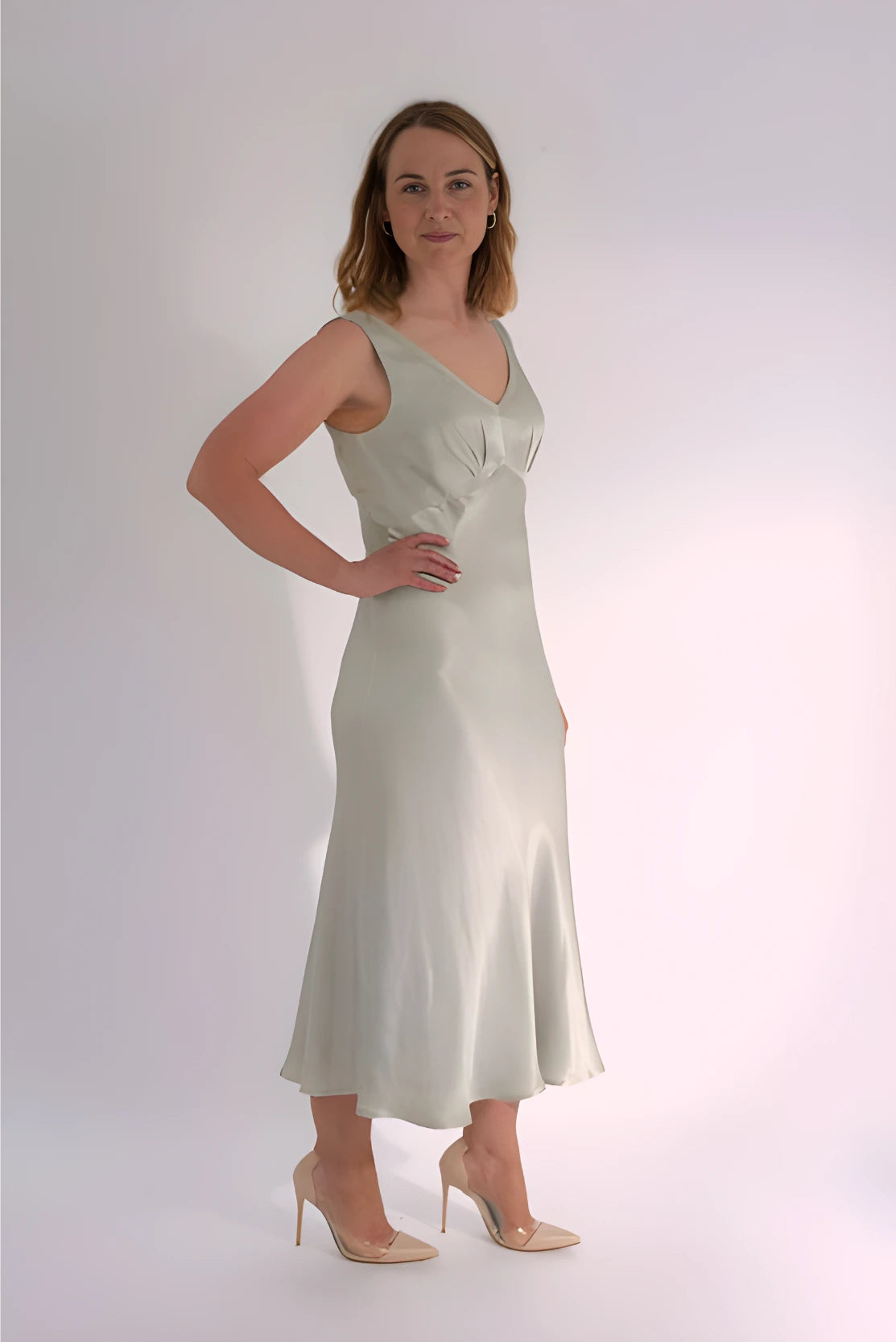 Stylish mother in silver satin occasion dress, designed for pregnancy & after, in beautiful quality from a luxury maternity brand - perfect for black tie events, special celebrations and evening formal dress events