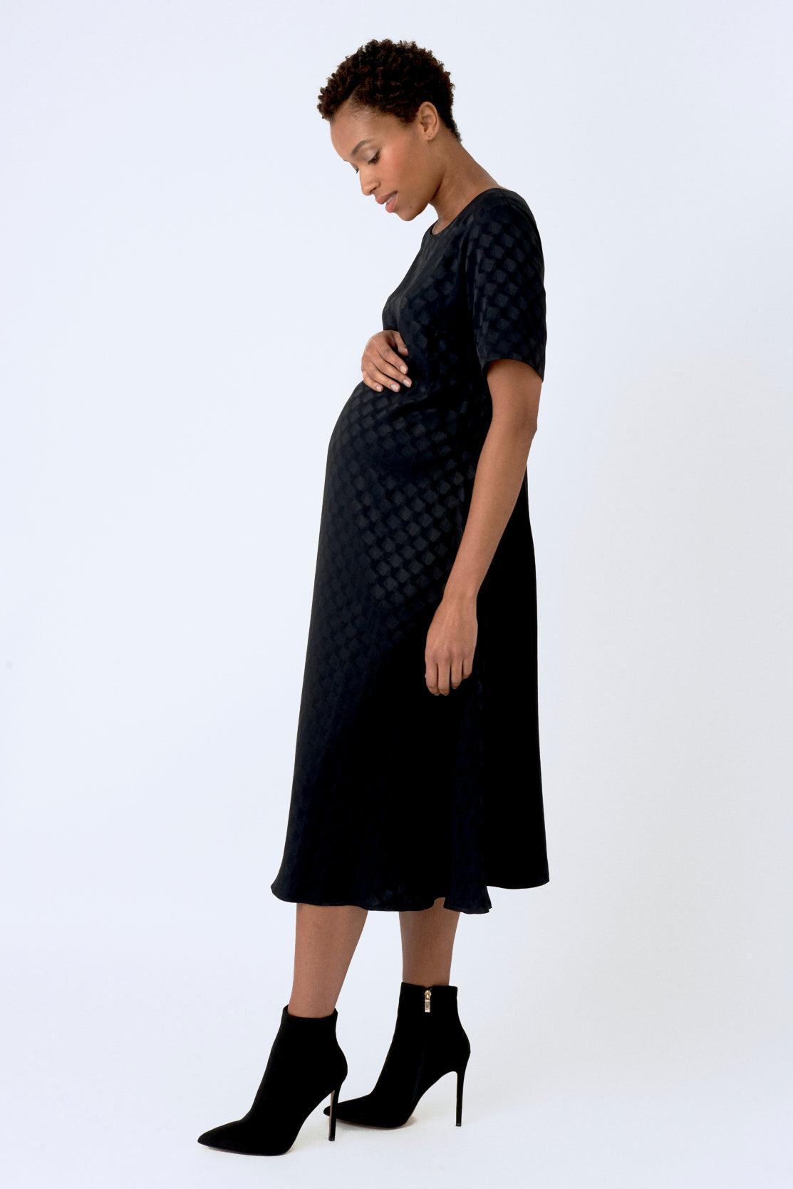 Black trapeze maternity dress. A-line trapeze style maternity dress, designed to be flattering for all stages of pregnancy and post-pregnancy too. Made in a beautiful luxurious textured satin, this is the perfect maternity dress for everyday, occasions or the office.