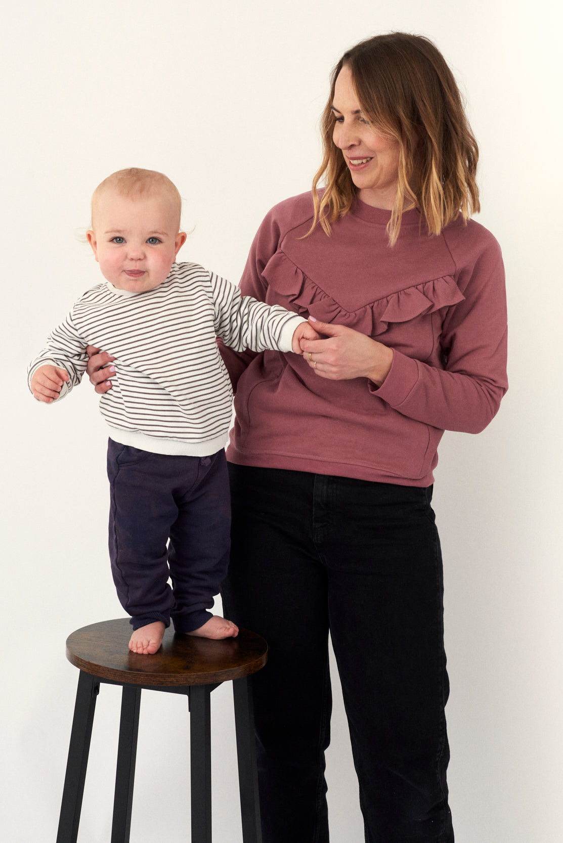 Breastfeeding Sweatshirt in Rose. Fashion meets functionality with this beautiful feminine style breastfeeding sweatshirt for new mums. Organic cotton soft against both yours and baby's skin. Concealed zips under the ruffle, open for perfect feeding access for your baby.